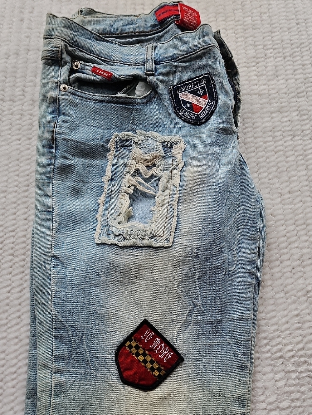 Le More Jeans with patches and distressed details (rips and fading) for a stylis